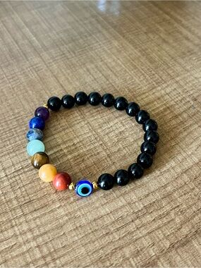 Seven chakras beaded bracelet with evil eye.